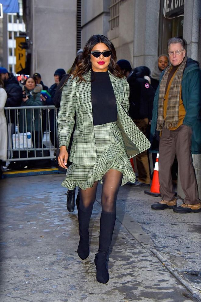 In a green plaid skirt suit by Michael Kors Collection while attending the brand's New York Fashion Week show.

Photo: Getty