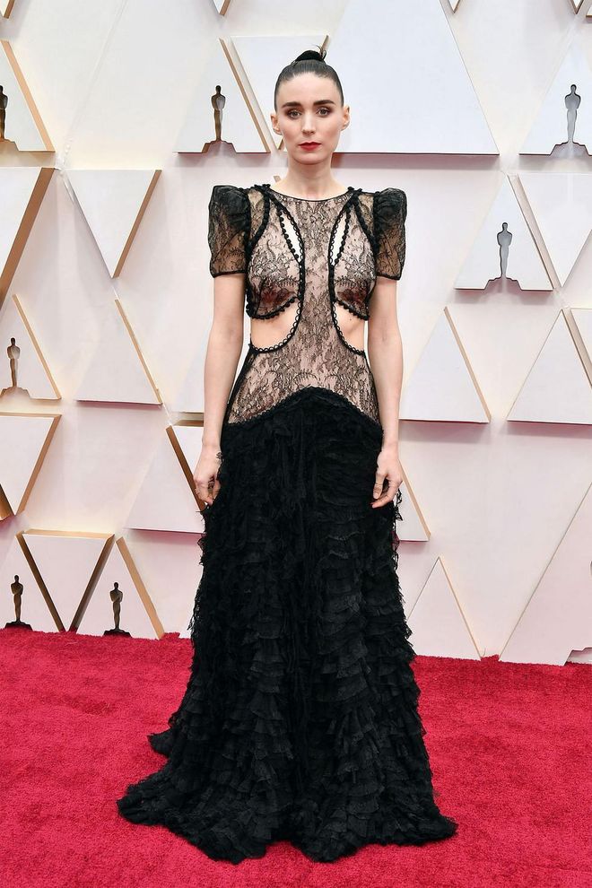 What: Custom Alexander McQueen

Why: Mara loves a great black gown, and tonight was no exception. The custom creation features cascading black lace with a slashed and cut away puff-sleeved bodice edged with rouleau loop buttons. The drop waist and cut-outs make it a stand-out. Photo: Getty
