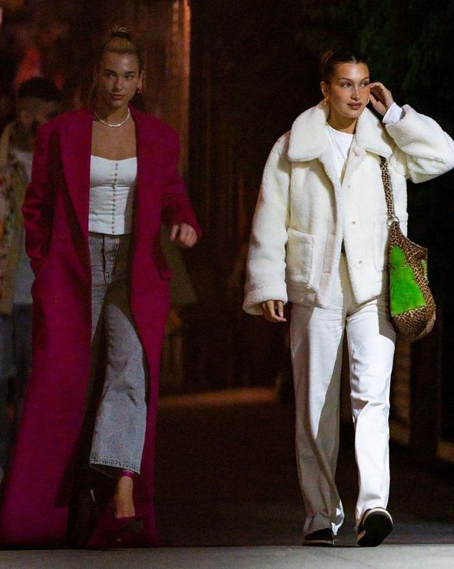 They were joined by Bella Hadid, in head-to-toe white, and Dua Lipa, who paired her wide-leg jeans with a floor-length fuchsia coat and matching heels.

Photo: Getty