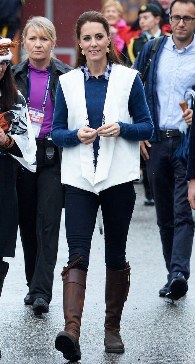 The Duchess of Cambridge layered a white vest over her practical hiking outfit yesterday while attending a performance by the Bella Bella First Nations Community at Wawiska Community Hall. Photo: Getty
