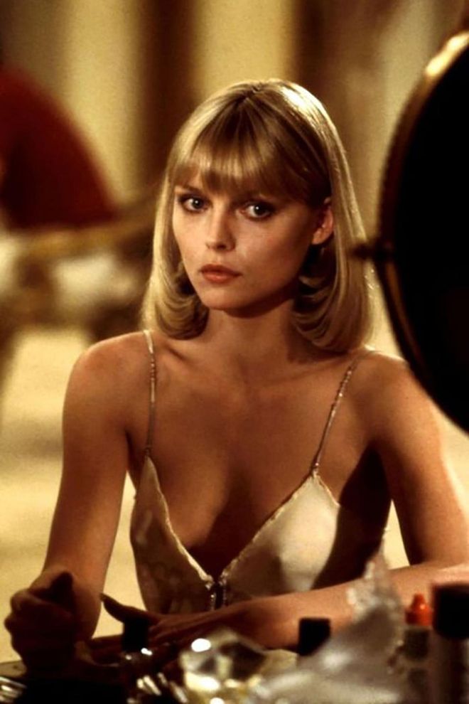 Michelle Pfeiffer transformed into a 1970s fashion dream as Elvira Hancock. From perfect slip dresses to plunging necklines and that chic all-white suit, Hancock's wardrobe stole the show in Scarface—and continues to inspire to this day.

Photo: Getty