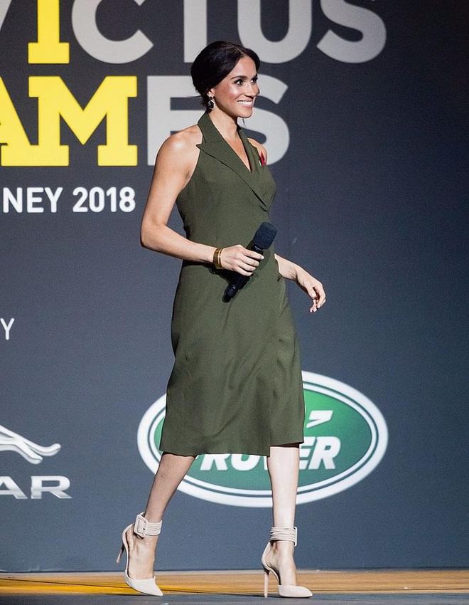 The Duchess attended the Invictus Games Closing Ceremony in Sydney wearing an olive halter tuxedo dress by Antonio Berardi and peach Aquazzura 'Casablanca' pumps. 