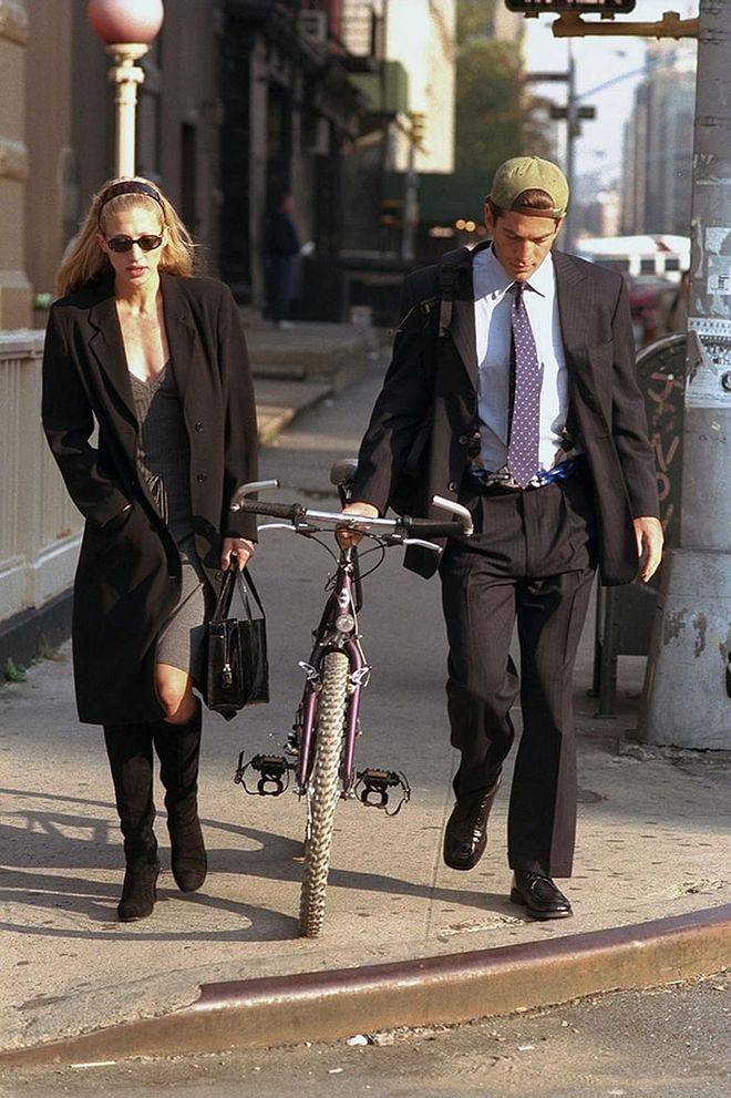 Arguably the most famous slip-dress advocate of the era, Besette-Kennedy strolls through downtown NYC with her husband, 1996. Photo: Getty
