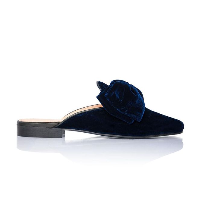 Add a little Marie Antoinette-inspired decadence to your office look with a pair of velvet slippers in midnight blue. 