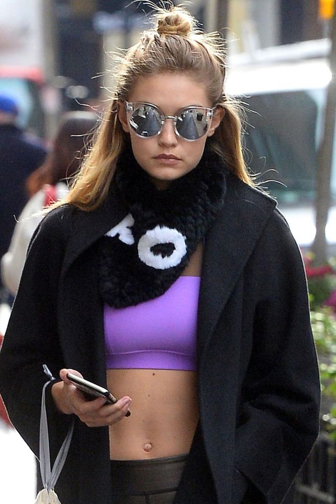 Gigi Hadid proves that the half bun is the ultimate gym accessory. Photo: Getty