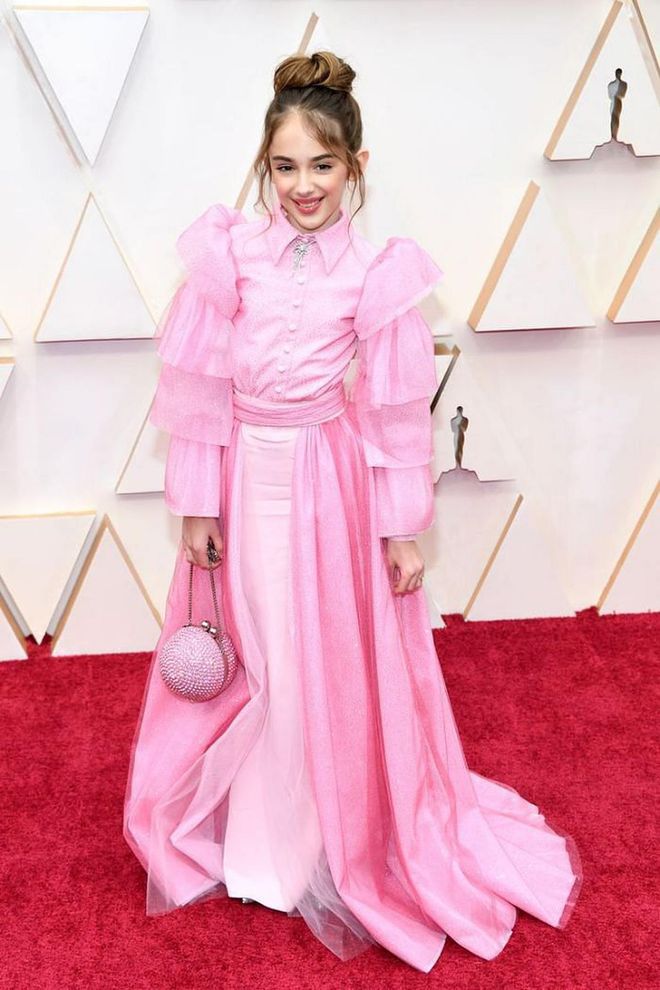 In a youthful, frilly pink Christian Siriano dress.

Photo: Kevin Mazur / Getty