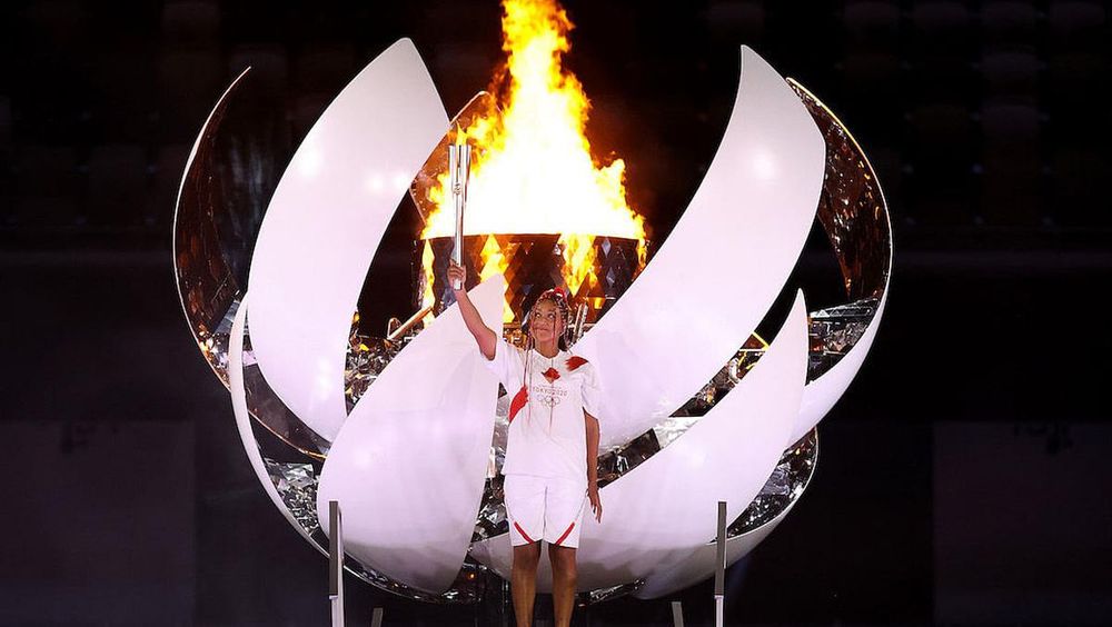 Naomi Osaka of Team Japan lights the Olympic cauldron with the Olympic torch during the Opening Ceremony of the Tokyo 2020 Olympic Games at Olympic Stadium on July 23, 2021 in Tokyo, Japan. (Photo: Jamie Squire/Getty Images)