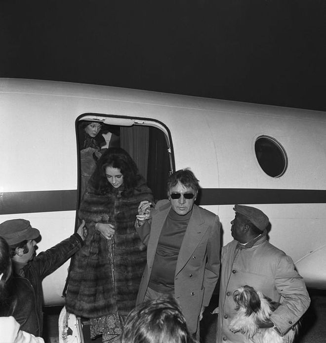 Getting off the plane with Richard Burton in Lido, Venice, 1974.

Photo: Getty 