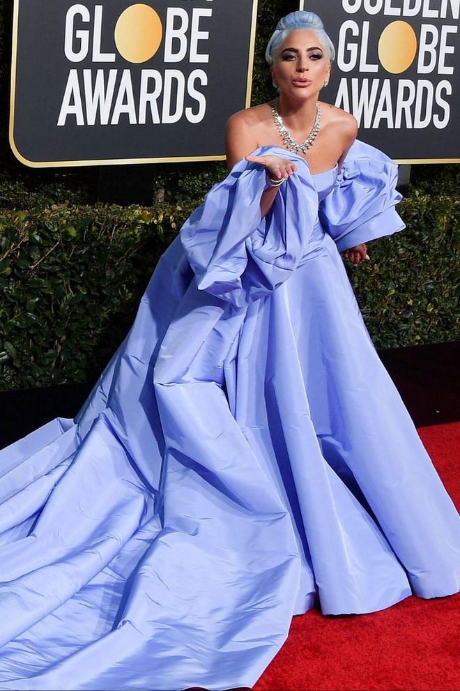 2019 was quite the year for Lady Gaga, which saw her scooping countless awards for A Star is Born. It also saw her upping her game fashion-wise in a series of high-octane gowns, culminating in her striptease entrance at the Met Gala. However, her red carpet highlight was this sky-blue Valentino couture dress that she wore to the Golden Globes. Gaga's gown resembled a dress that Judy Garland wore in the original 1954 version of A Star is Born - the role for which Gaga was nominated. She later said that the comparison was actually a happy accident, but admitted that "it looks an awful lot like it, doesn't it?"

Photo: Getty