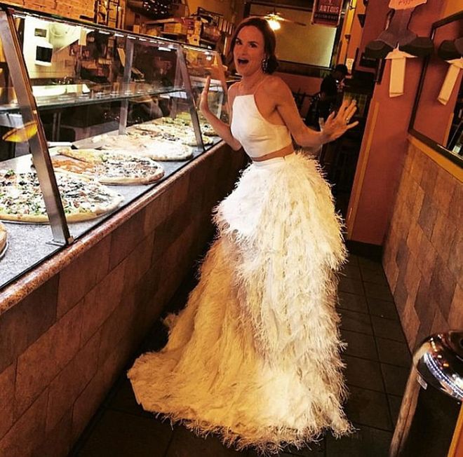 Thoughts running through the actress' head: 1. Don't drip, don't drip, don't drip. 2. Pizza comes out of a billowing skirt of white feathers, right?
Photo: Instagram