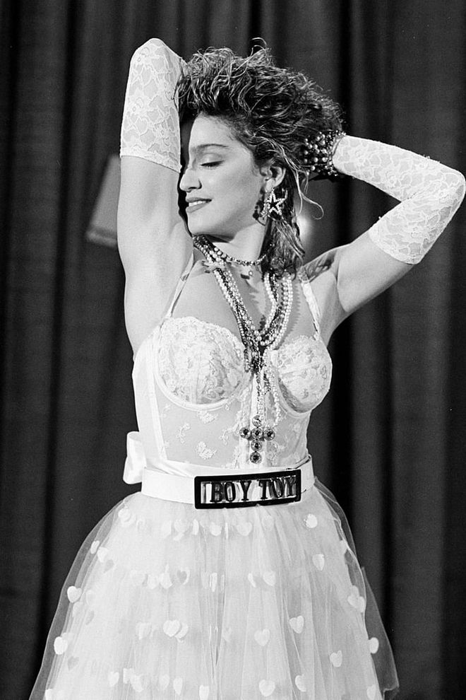 In 1984, Madonna was an up-and-coming artist and had the opportunity to perform "Like a Virgin" at the MTV Video Music Awards. She was wearing a white bustier top, opera-length lace gloves, and a belt that had the words "boy toy" on it. She writhed around on the floor, possibly flashed the audience, and caused a sensation. Her publicist Liz Rosenberg said, "People came up to me and told me her career was over before it started." People were wrong.
