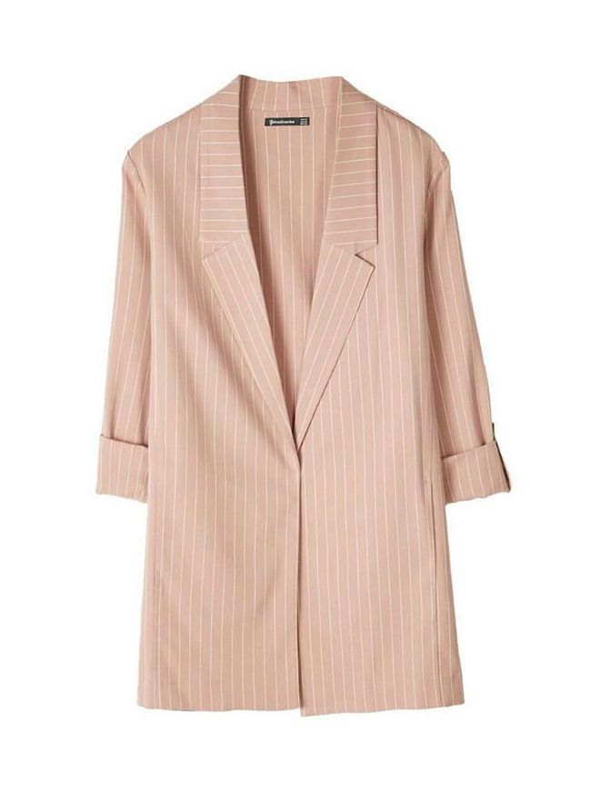 The vertical stripes and longline silhouette of this Stradivarius blazer give the illusion of extra length, perfect for those who have a shorter torso and wish to look taller. This feminine pastel pink shade will also soften a masculine shirt and trousers combo.

