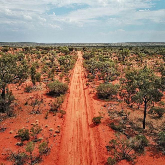 The late 2019 closure of Uluru, in Australia’s Northern Territory, was an important moment of reckoning—a line quite literally drawn in the sand qualifying the limit of cultural commodification for capital gain. The shuttering of the sacred mountain to hikers has helped refocus travelers’ attention. Now, visitors are heading further north to the country’s “top end”—a streamer of coastline between western and eastern Australia—to discover some of the most wild and remote land in the entire world.

Start in state-capital Darwin, which gets its first high-end hotel, a sprawling Westin, in late 2020. Then, puddle-jump between a handful of stylish-but-simple lodges peppered across vast acres of bayou, desert, gorges, paperbark forests, and some of the most stunningly secluded beaches in the country. Aim for Davidson’s in the shadow of Mount Borradaile, a hallowed mound where generations of ancestors are buried. Some of the oldest art known to man—(think brilliant paintings)—adorn the rocks along the steeper walking paths.

For an even more outdoorsy experience, guests at Cobourg Coastal Camp inhabit eco-chic tents on a bluff overlooking the sea. Days are spent plucking oysters and eating them fresh right off the beach, or shuttling across the bay on a private speedboat, stopping occasionally to catch fish for your seaside picnic later on. Finish your adventure at Bamarru Plains, a hideaway on an old ranching station that’s easily as posh as any faraway African safari lodge with unique half-tent bedrooms encased in a thin, impermeable skin keeping the comfort in and the thumping wallabies out.

Photo: Felix Cesare / Getty