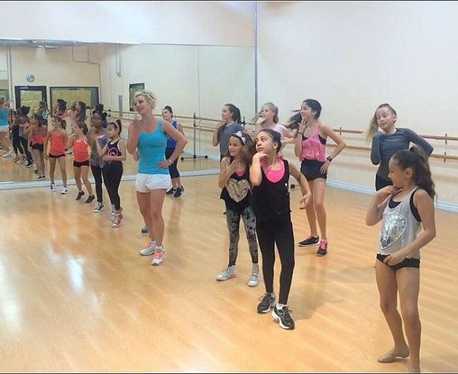 Because she loves kids (and knows a thing or two about killer choreography), Britney Spears treated the lucky little ladies of L.A.'s Rockit Dance Studio to a Madonna-inspired dance lesson.
"Surprised the girls at @rockitdancestudio today!," the singer wrote on Instagram. "Thx for letting me take over your class @lenagold! They rocked it ?"
You can watch all of the adorable videos from the class here. Photo: Instagram