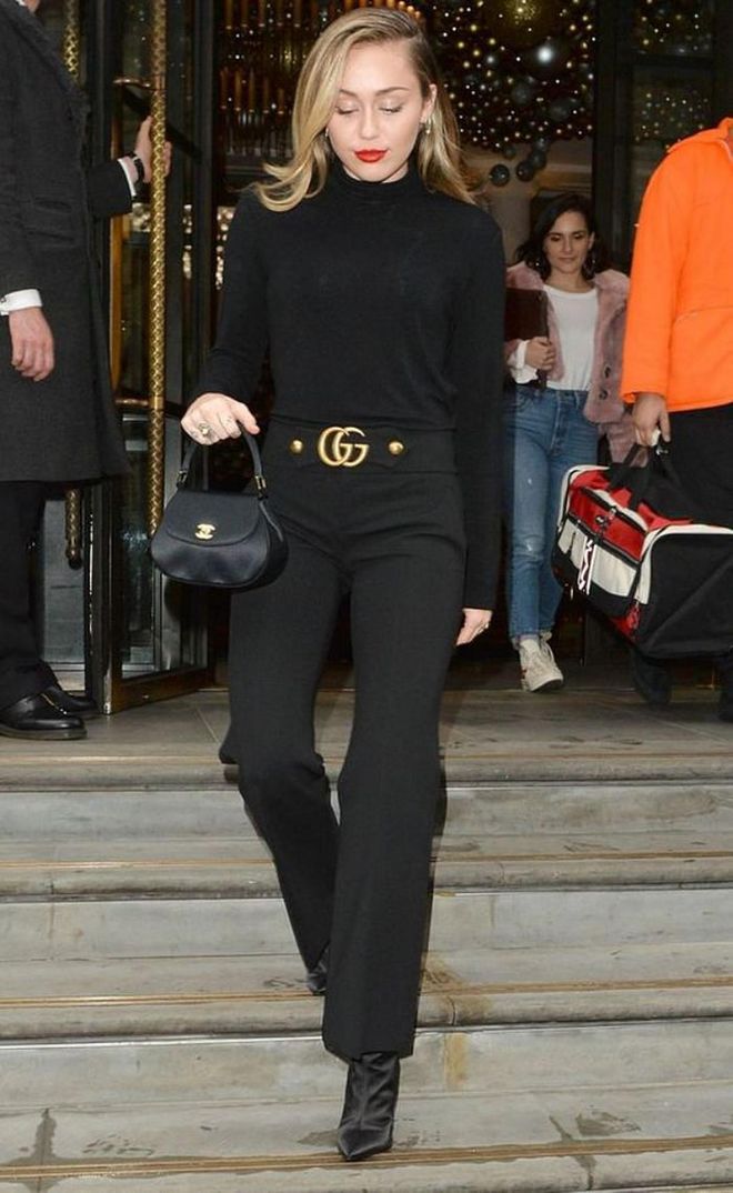 Miley steps out in a chic ensemble of Vince turtleneck sweater, Gucci Stretch Viscose Pants with Double G, a Chanel bag and Public Desire boots.

Photo: Pinterest
