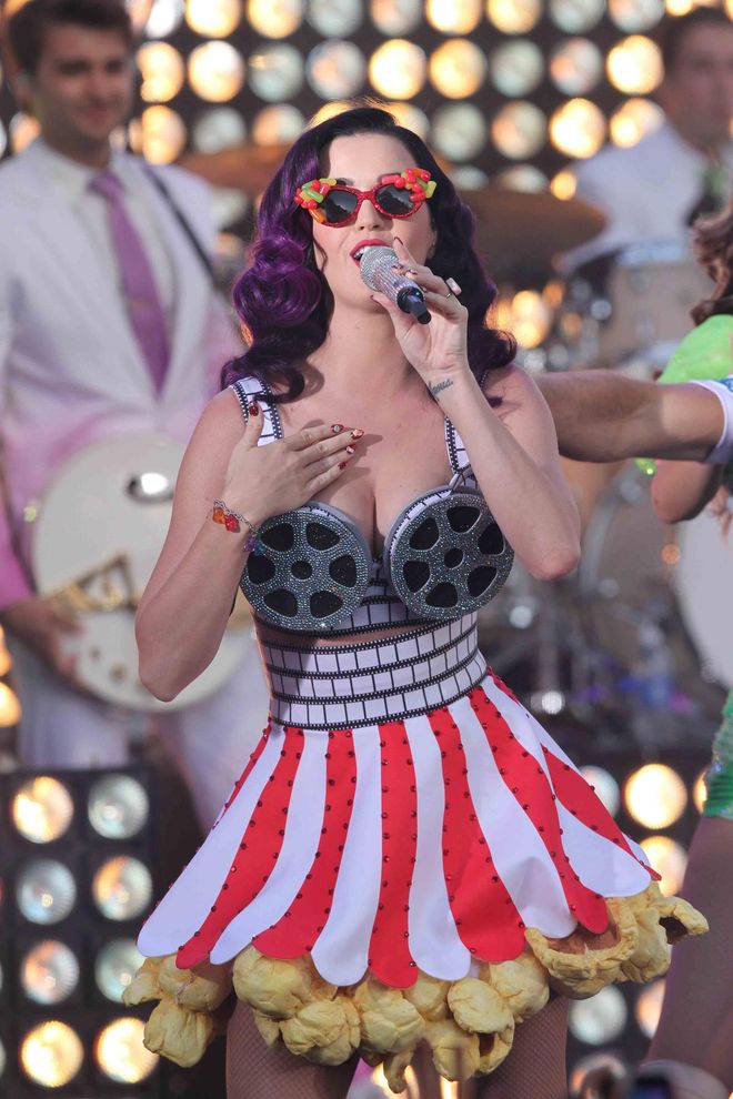 At a premiere event for her documentary "Katy Perry: Part of Me," the singer performed in a movie-themed dress that included a film reel bustier and a popcorn-fringed skirt.