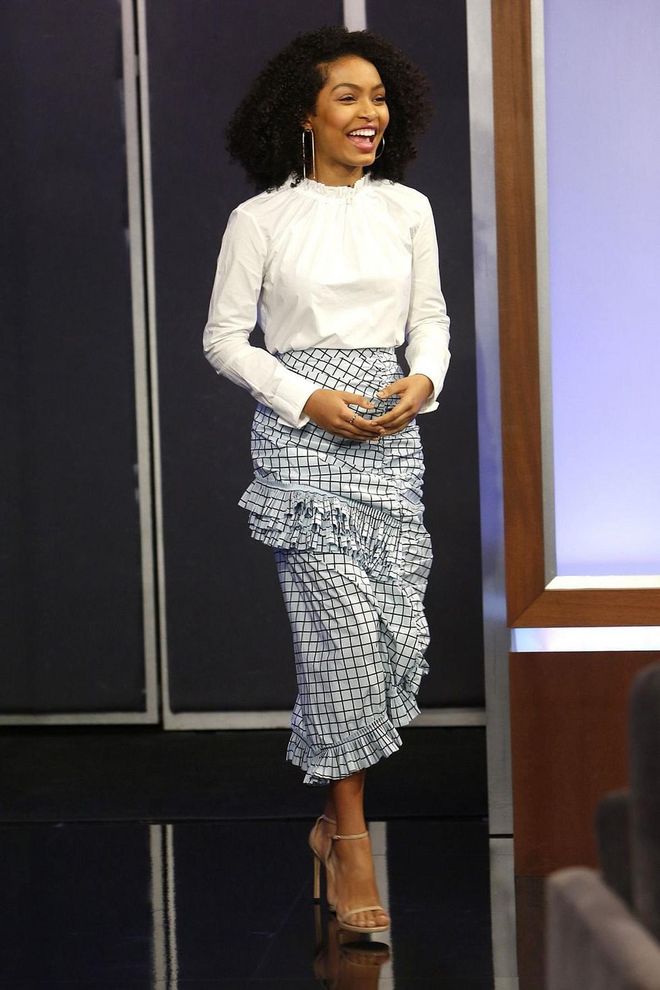 Yara Shahidi makes the statement skirt shine, in plaid and ruffles paired with a simple white poplin top and nude sandals. Photo: Getty 