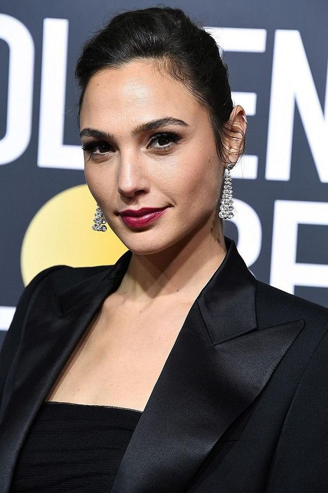 Just a pair of diamond dangling Tiffany & Co. earrings for Gal Gadot that night. Photo: Getty  