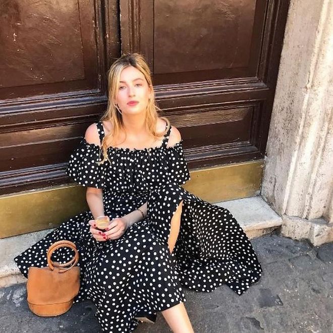 Embrace polka dots in the form of a romantic ruffled sundress.

Photo: Instagram via @camillecharriere
