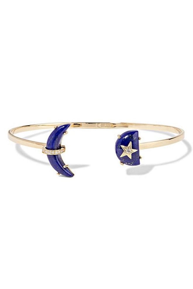 This delicate Andrea Fohrman bracelet includes two lapis lazuli gemstones finished with diamond detailing.