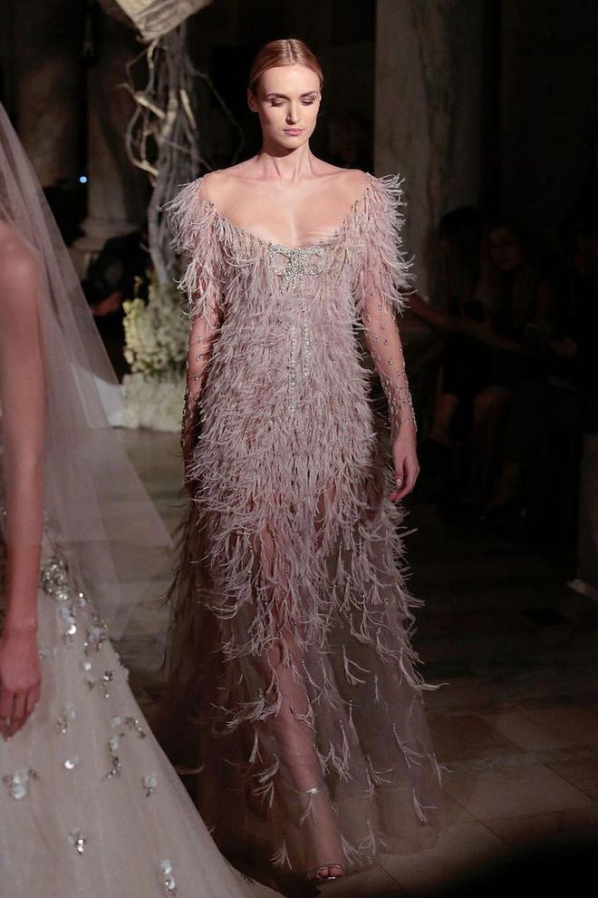 Just as in the ready to wear shows, feathers showed up in full force at the bridal runways. Frocks in feather trimmings makes for a theatrical yet elegant look.