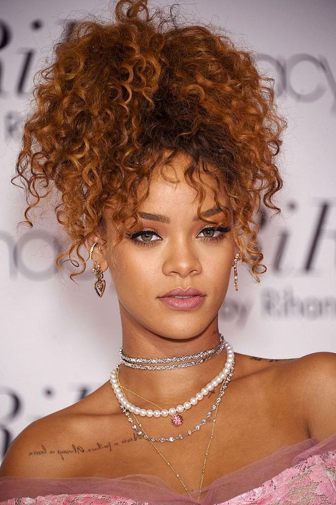 Lots of tight, kinky curls work just as well pinned up in the back and flipped forward as they do in a ponytail or hanging down. Photo: Getty