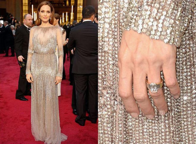 Brad Pitt designed Angie's ring with jeweler Robert Procop, ensuring the diamond was of "the finest quality and cut it to an exact custom size and shape to suit Angelina's hand." A representative told CNN after the engagement's announcement that "the side diamonds are specially cut to encircle her finger."

