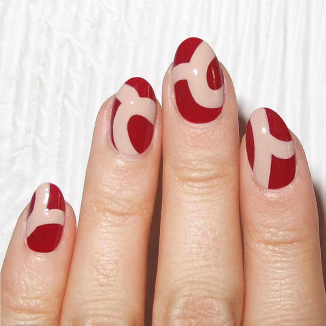 Swipes of nude give crimson nails an artistic edge. @nataliepavloskinails