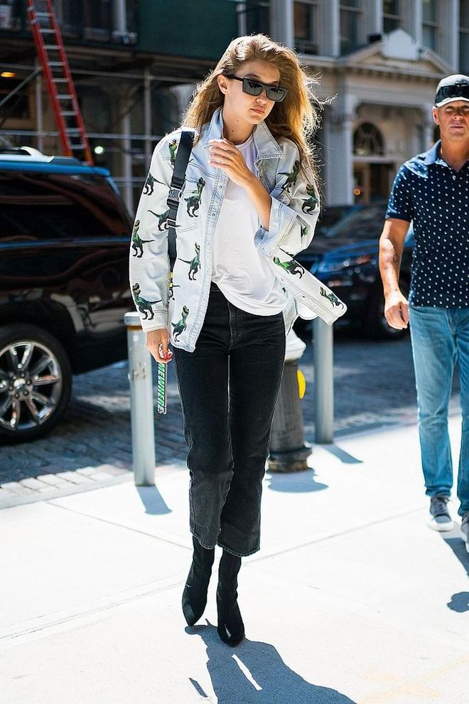 Out and about in NYC in a dinosaur patterned denim jacket over a white tee and black jeans. 
