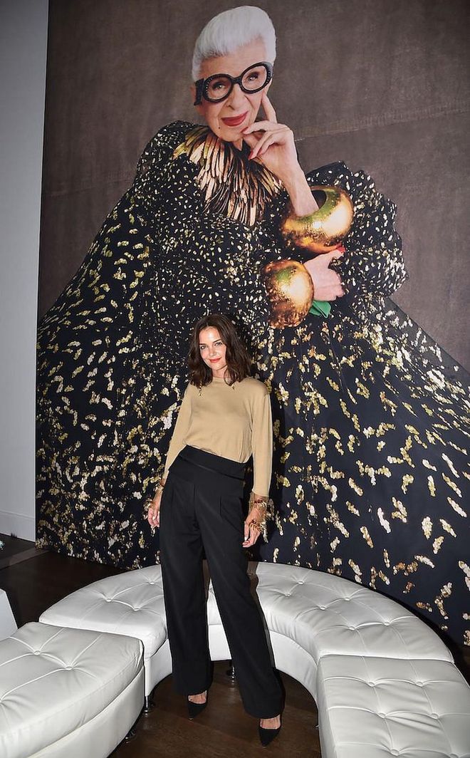 Katie Holmes poses in front of a portrait of Iris. (Photo: Getty Images)