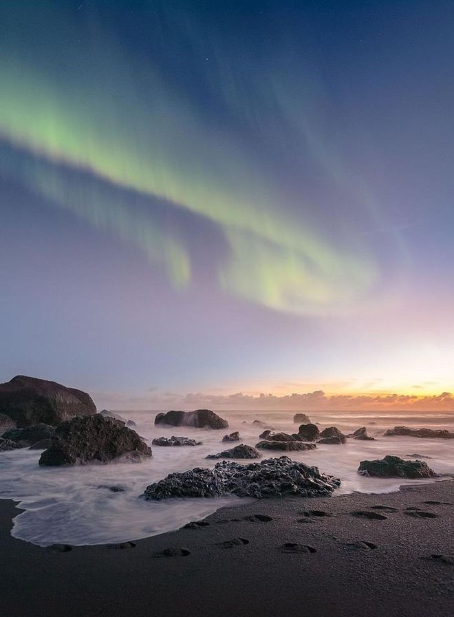 There's nothing like watching the sun set at the beach — except, maybe, watching the Northern Lights dance in the sky. The beach in the town of Vik is a tranquil place to catch this colorful show, while listening to the waves crash.