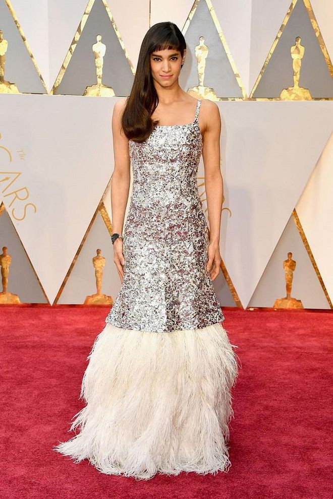 Newcomer Sofia Boutella wowed on the carpet in a breathtaking Chanel Haute Couture gown from the latest runways. Her crystal-encrusted, feather-skirted mermaid silhouette would also wow down the aisle - and look just as good for a wedding paired with edgy Chanel Fine Jewelry ear cuffs she donned for the awards. 