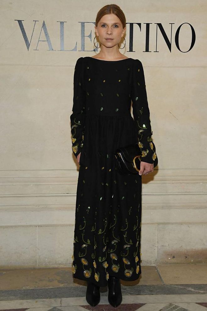 Clemence Poesy attended the Valentino show in a black dress by the French fashion house embroidered with 3D flowers.