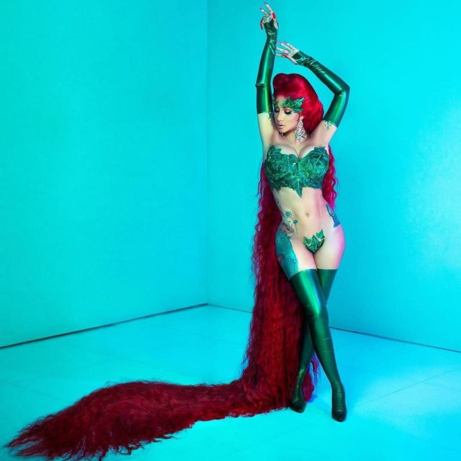 The rapper dressed in a sexy Poison Ivy costume, complete with a seven-foot wig.