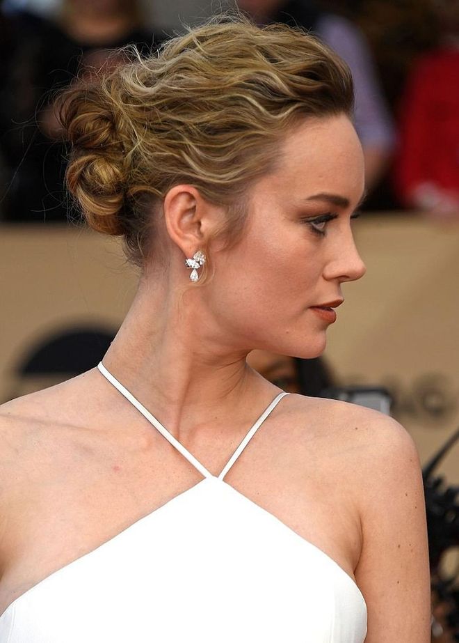 Brie Larson's fuzzy chignon is the perfect way to embrace your natural curl texture. Photo: Getty 