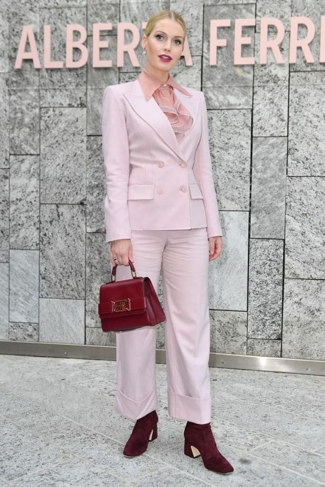 Lady Kitty Spencer wore a pastel pink suit with burgundy accessories.

Photo: Getty