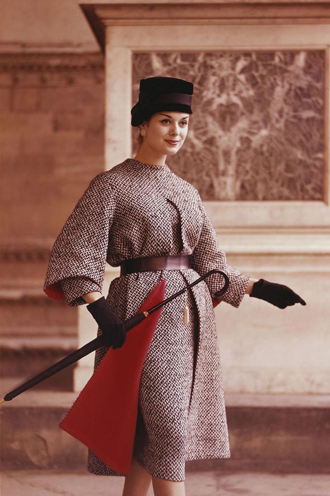 A model shows off a tweed coat design with matching accessories. Photo: Getty 