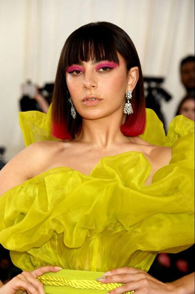 Want all eyes on your shorter cut? Consider dyeing the ends a bold shade. Charli XCX has been rocking neon pick ends for months—and they always add a touch of punk energy to her look.

Photo: Getty