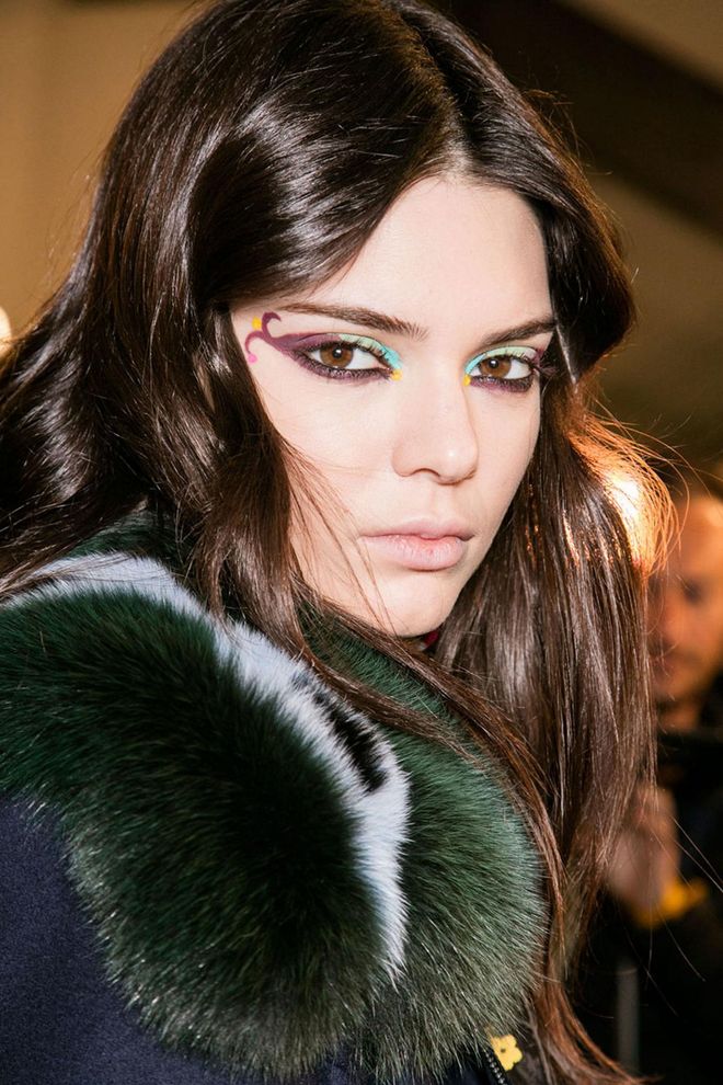 Nevada's Burning Man festival was one of the references for the beauty look at Fendi for autumn/winter 2016. Using myriad colours, including aubergine, turquoise and orange, the make-up artist Tom Pecheux painted playful swirls across the eyes. For the models who wore sunglasses, Pecheux added a bright lip.