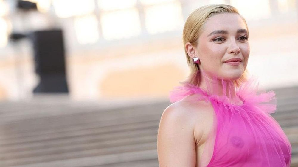 Florence Pugh Wore an Enormous Pink Coat Over a Bra Top to the