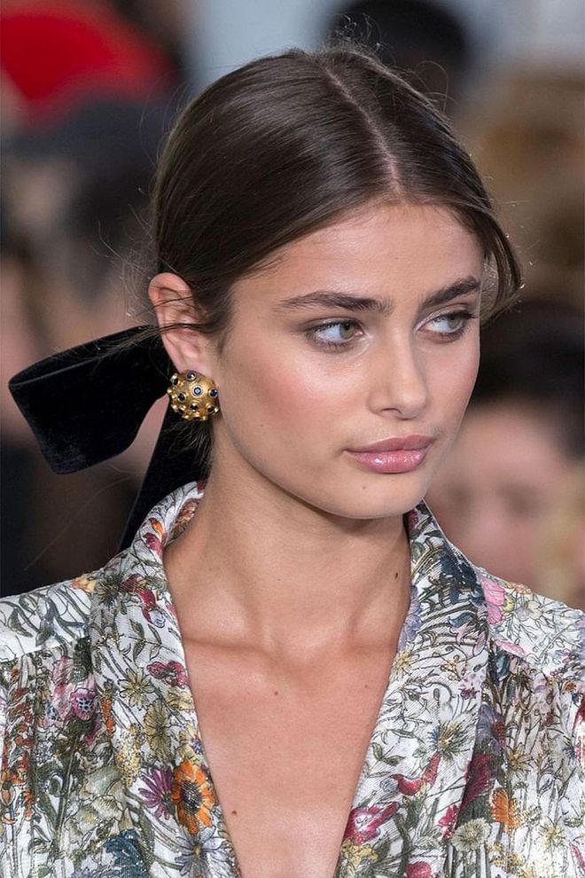The giant, floppy, black velvet hair bows seen at Tory Burch's fall show kicked off the black hair ribbon trend.