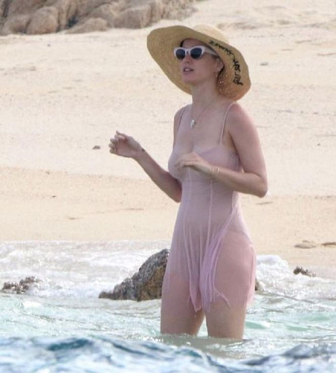 Do as Katy Perry does when you're at the beach but also don't mind being a bit extra: A giant sunhat (looking at you, Eugenia Kim), a mini-dress (give or take on the waterproof bit), and some retro cat-eye shades. <b>Eugenia Kim Sequined Embellished Straw Hat, S$688</b>