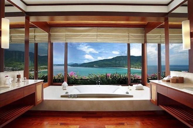 Located on the west coast of Phuket in Thailand, the Andara Resort features a bathroom overlooking Kamala Beach, the Andaman Sea and lush green mountains. The resort also throws in a private chef for good measure.