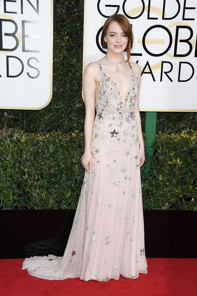 Emma Stone took celestial motifs to new heights and cheekily nodded to LaLa Land's "City of Stars" theme song at the 2017 Golden Globes in Valentino Haute Couture. The delicate pale ivories, nudes and metallics of her look were subtle against her pale complexion, and paved the way for her stellar Tiffany & Co. collar to complement the look without appearing overdone. 