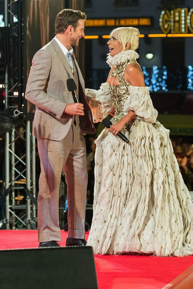 The singer-turned-actress, who looked regal in an Alexander McQueen gown, joined Cooper onstage with a laugh.
Photo: Getty