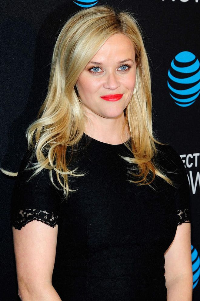 Between Witherspoon's blue eyes, blonde hair, and a nearly neon shade of lipstick, you almost forget she's wearing black.
