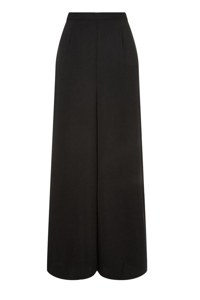 Wide-leg black trousers can be dressed up on down depending on your sensibility - go fort a relaxed vibe and wear with a T-shirt and trainers or with a silk white shirt and heels for an evening affair.