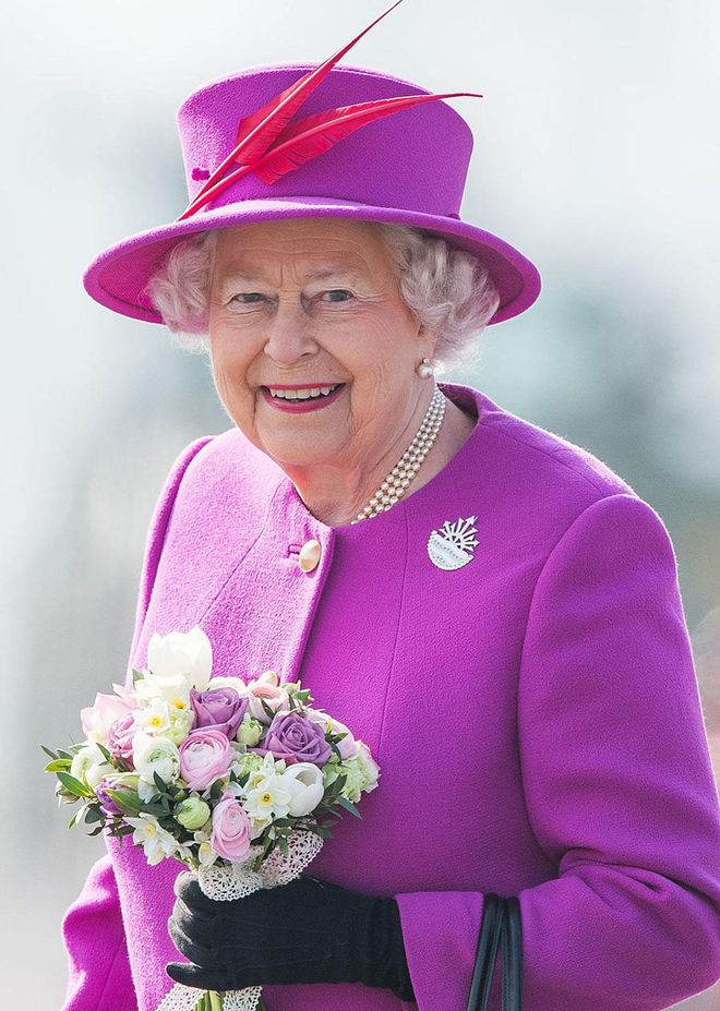 For basically every formal occasion, the Queen wears a hat that perfectly matches her bright outfits. Apparently it comes from a very old tradition that women should keep their hair covered. "Up until the 1950s, ladies were very seldom seen without a hat as it was not considered 'the thing' for ladies to show their hair in public,” Diana Mather from The English Manner etiquette consultancy told BBC. "But all that has changed, and hats are now reserved for more formal occasions.”

On the rare occasions when the Queen isn't sporting a hat, you might see her wearing a crown or a headscarf instead.
Photo: Getty