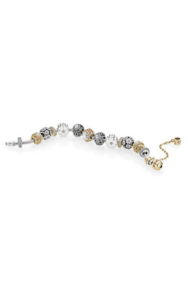 We've always loved the idea behind charm bracelets, which allow you to create a personal trinket, but the original design was often cumbersome to wear. Pandora's modern take has turned the Monopoly-token charms into smaller beads, some decorative, some meaningful in design.
Sterling silver Moments bracelet with 14ct gold clasp, £275, with charms, from £30, Pandora