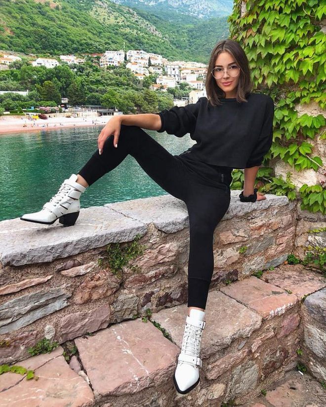 Olivia wearing a full black getup  by H&amp;M and white Chloé boots for her last day in Montenegro. Photo: Instagram/@oliviaculpo